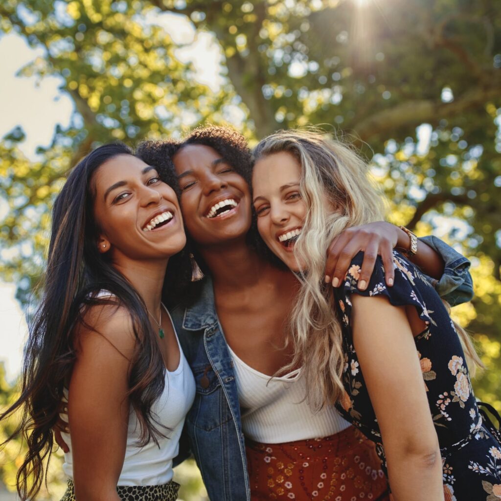 happy group of smiling female friends